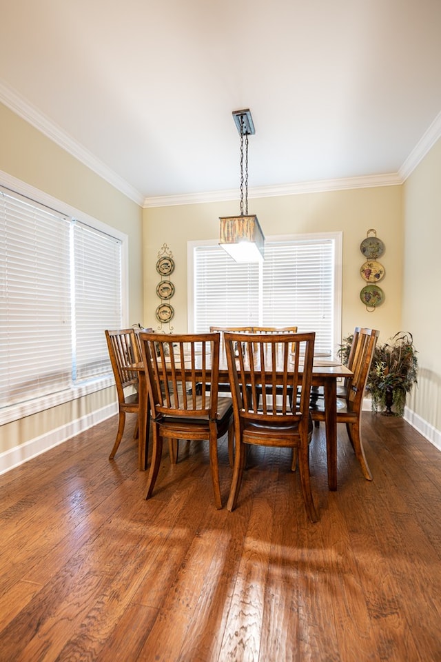 8030 Northwood Dr, Donalsonville, GA 39845 - dining room featuring crown molding and hardwood / wood-style flooring