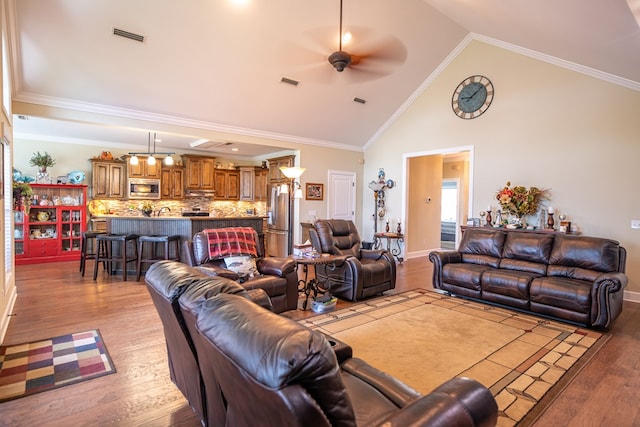 8030 Northwood Dr, Donalsonville, GA 39845 - living room featuring ceiling fan, ornamental molding, and light wood-type flooring