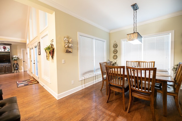 8030 Northwood Dr, Donalsonville, GA 39845 - dining room featuring french doors, ornamental molding, and hardwood / wood-style flooring