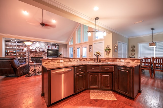 8030 Northwood Dr, Donalsonville, GA 39845 - kitchen with sink, high vaulted ceiling, stainless steel dishwasher, pendant lighting, and a kitchen island with sink