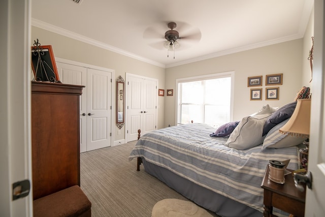 8030 Northwood Dr, Donalsonville, GA 39845 - carpeted bedroom featuring ceiling fan, crown molding, and two closets