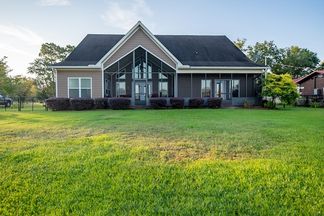 8030 Northwood Dr, Donalsonville, GA 39845 - rear view of property with a lawn and a sunroom