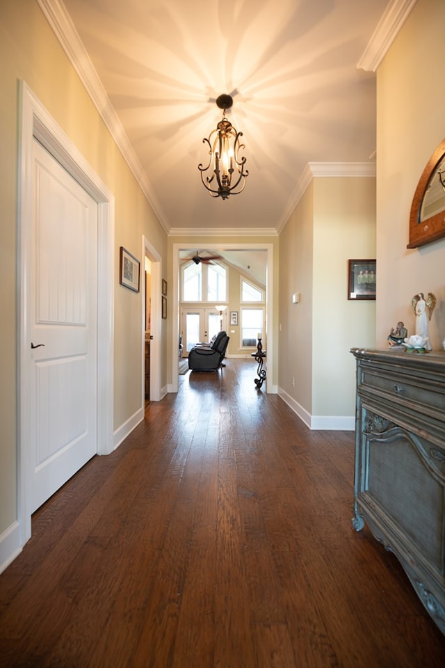 8030 Northwood Dr, Donalsonville, GA 39845 - hall with dark hardwood / wood-style flooring, ornamental molding, and an inviting chandelier