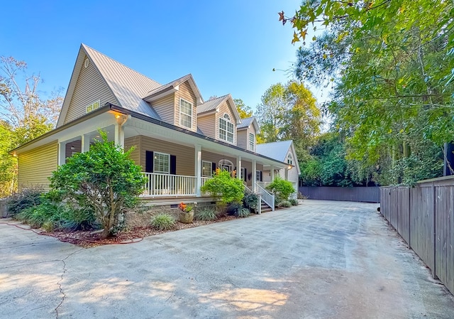 view of property exterior featuring a porch