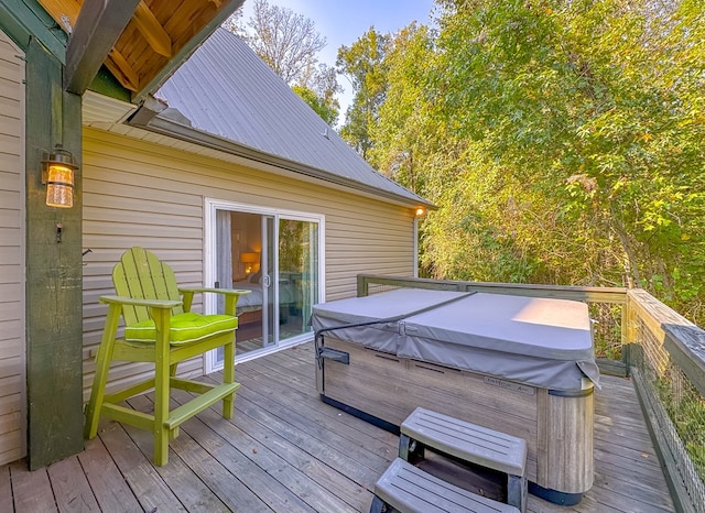 wooden deck featuring a hot tub