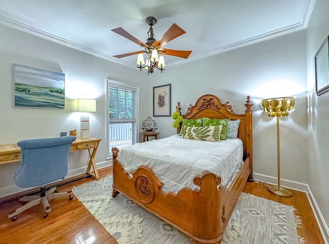 bedroom with ceiling fan, crown molding, and light hardwood / wood-style floors