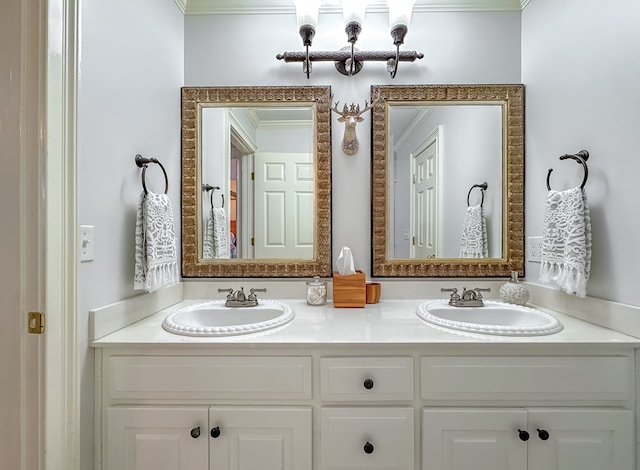 bathroom with crown molding and vanity