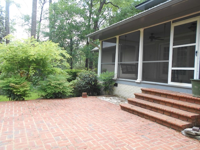 view of patio / terrace featuring a sunroom