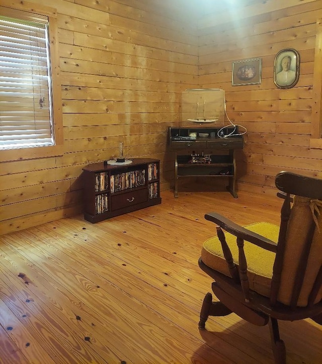 1210 Elkins Rd, Cairo, GA 39827 - sitting room featuring hardwood / wood-style floors and wooden walls