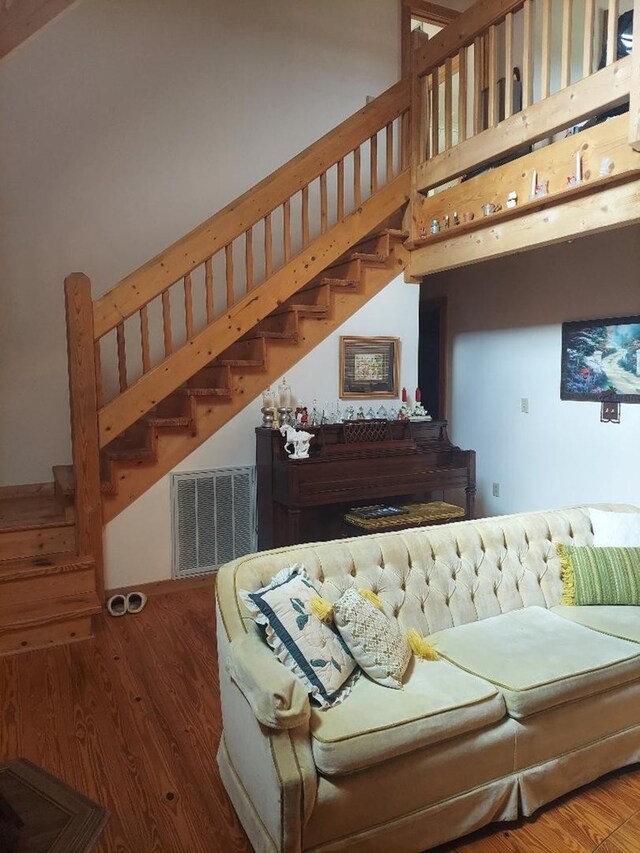 1210 Elkins Rd, Cairo, GA 39827 - living room featuring stairs and wood finished floors