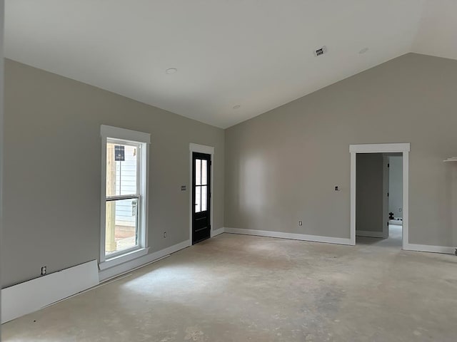 empty room featuring high vaulted ceiling