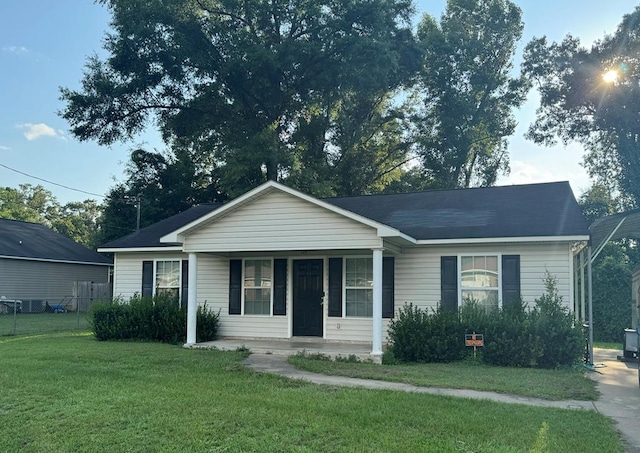 view of front of property with covered porch and a front yard