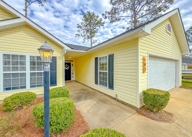 property entrance with a garage