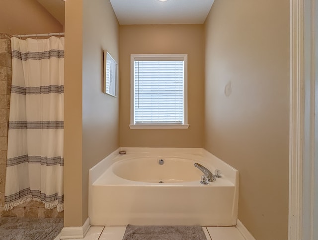 bathroom with separate shower and tub and tile patterned flooring