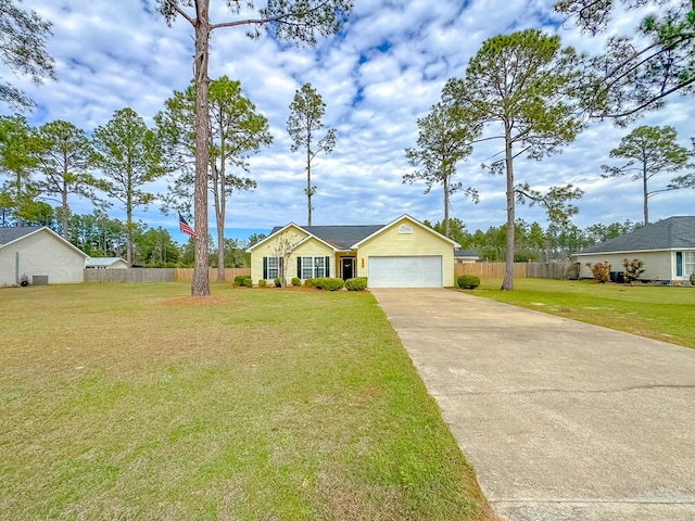 ranch-style home with a front lawn and a garage