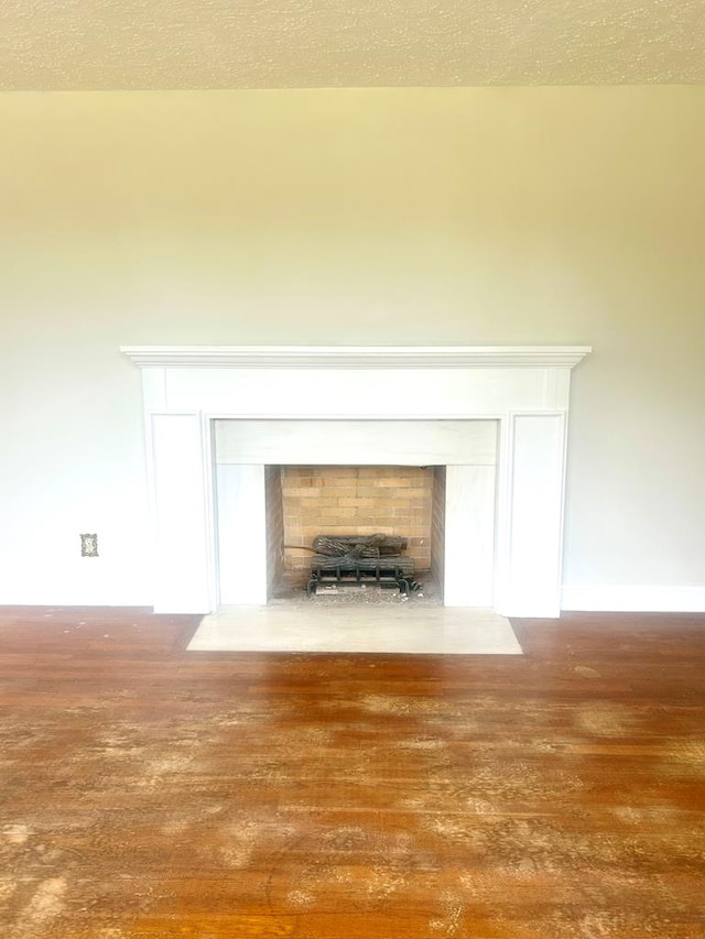 356 E Main St, Colquitt, GA 39837 - detailed view of wood finished floors, a fireplace with flush hearth, and baseboards