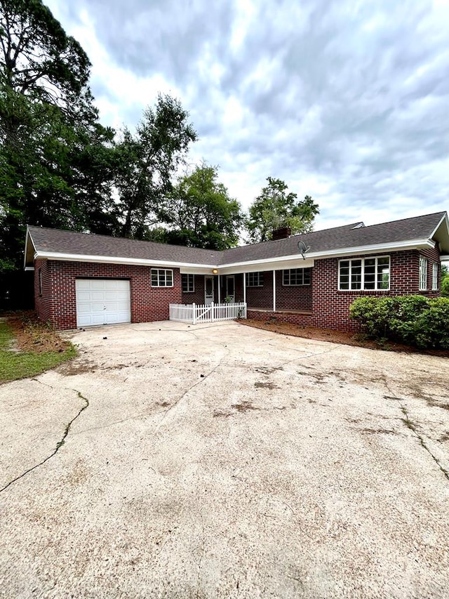 356 E Main St, Colquitt, GA 39837 - single story home with brick siding, an attached garage, and concrete driveway