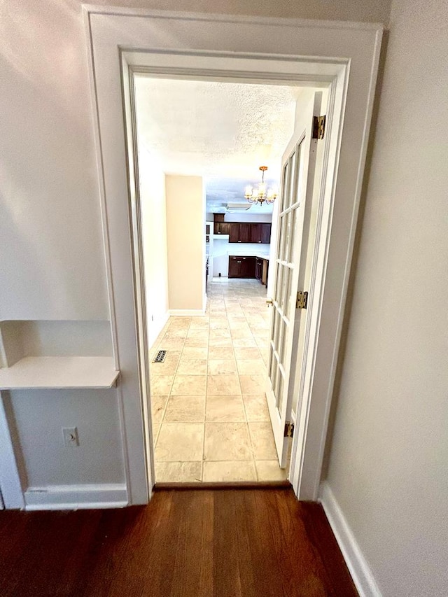 356 E Main St, Colquitt, GA 39837 - corridor featuring a chandelier and baseboards