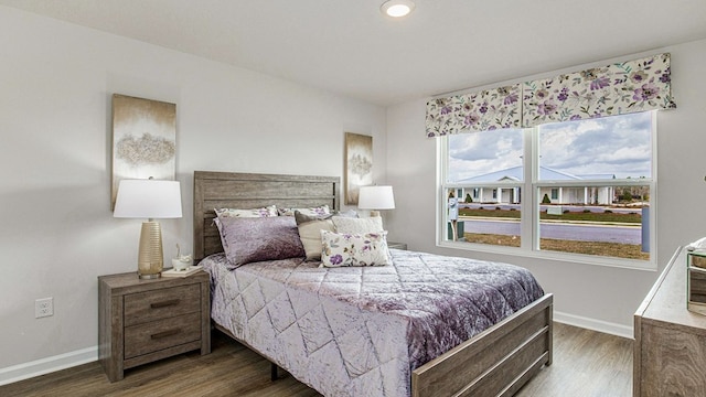 bedroom featuring dark hardwood / wood-style flooring