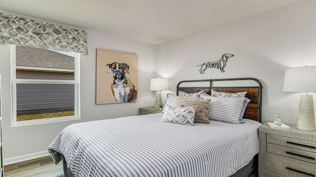 bedroom with wood-type flooring