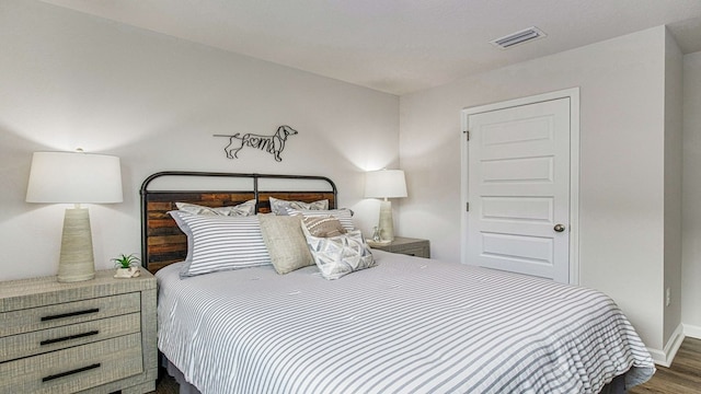 bedroom featuring dark wood-type flooring