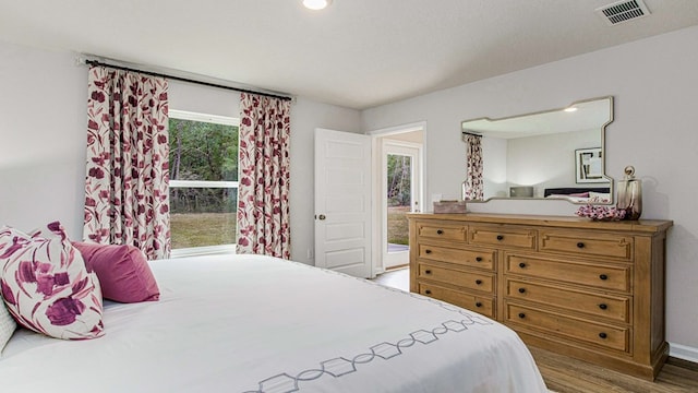 bedroom featuring hardwood / wood-style flooring