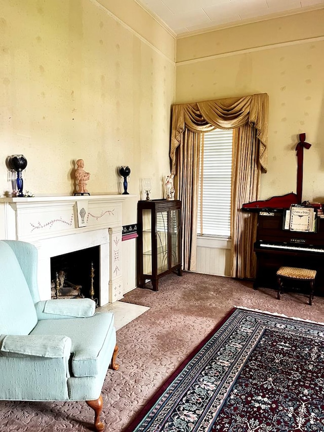 living area with a fireplace with flush hearth and carpet flooring