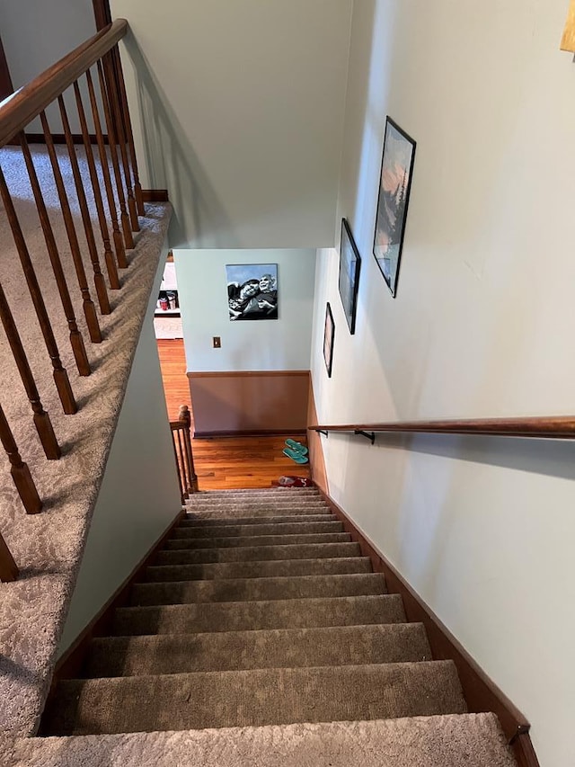 stairs with wood finished floors