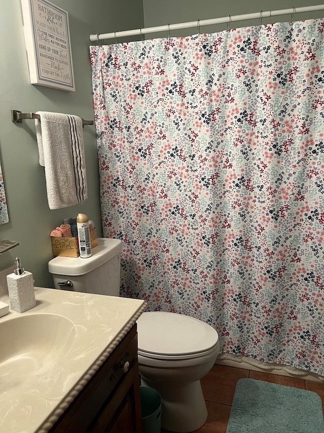 full bath with tile patterned floors, toilet, vanity, and a shower with curtain