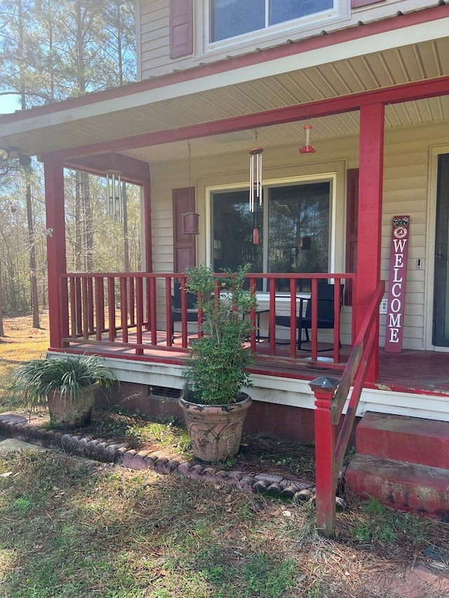 doorway to property with a porch