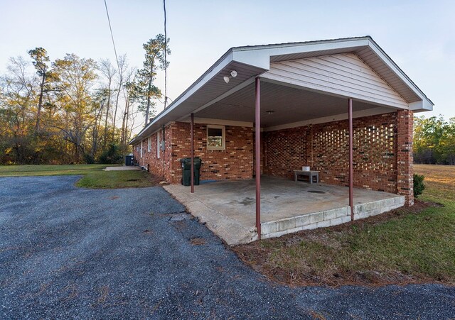 view of side of home featuring a carport