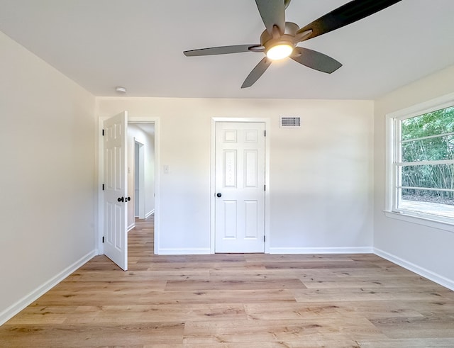 unfurnished bedroom with a closet, ceiling fan, and light hardwood / wood-style flooring