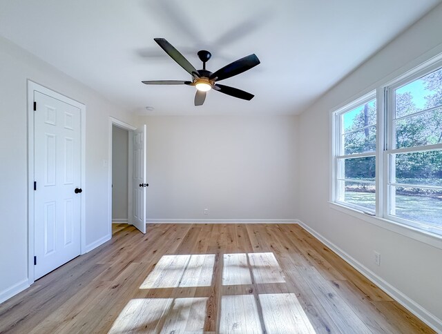 unfurnished room with light hardwood / wood-style floors and ceiling fan