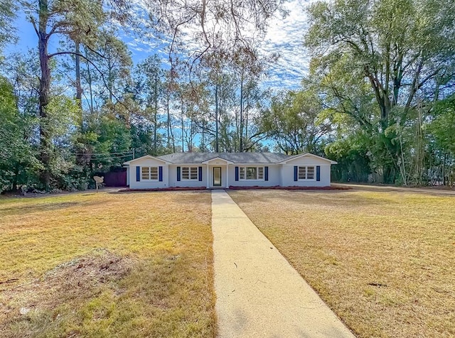 ranch-style home with a front lawn