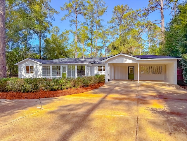 ranch-style house with a carport