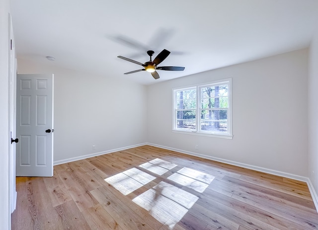 spare room featuring light hardwood / wood-style floors and ceiling fan