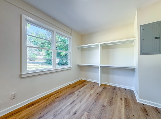 interior space with electric panel and light wood-type flooring