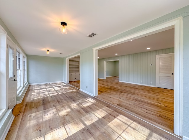 spare room with light hardwood / wood-style floors