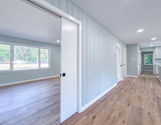 corridor featuring light hardwood / wood-style flooring