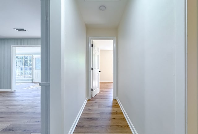 hall with light hardwood / wood-style flooring