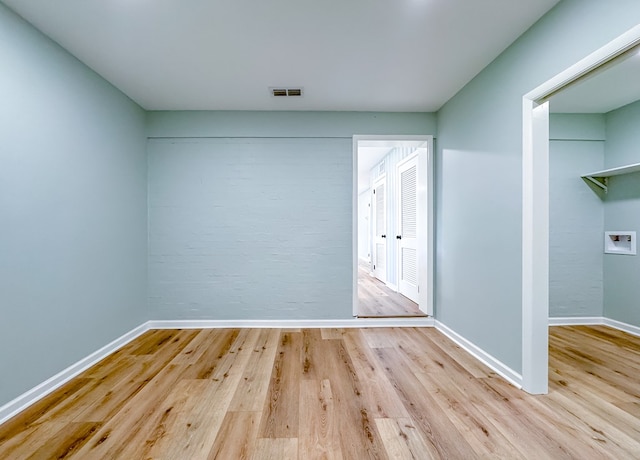 spare room featuring light hardwood / wood-style floors