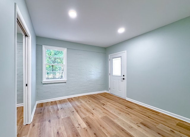 unfurnished room with light hardwood / wood-style floors