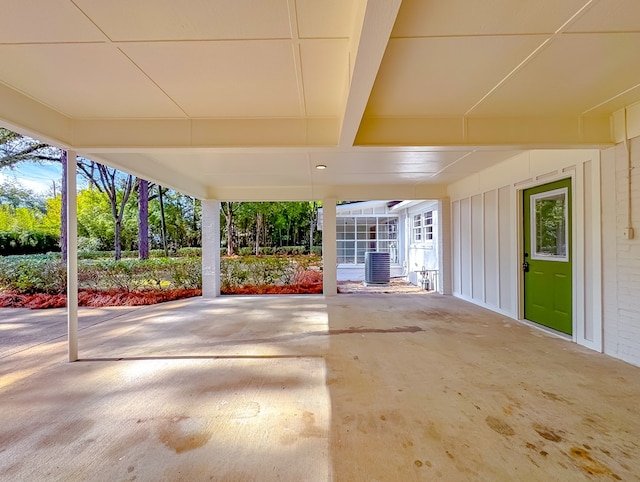 view of patio / terrace with central air condition unit and glass enclosure