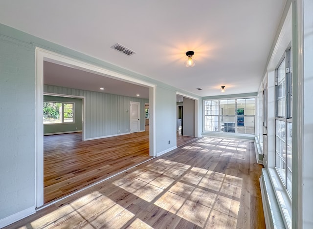 spare room with light hardwood / wood-style floors