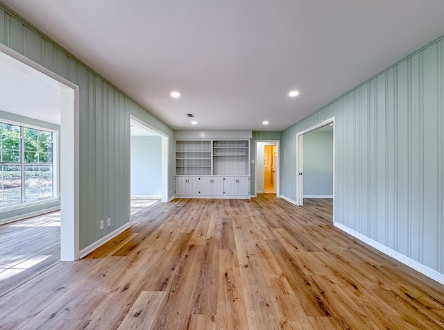 unfurnished living room with light wood-type flooring