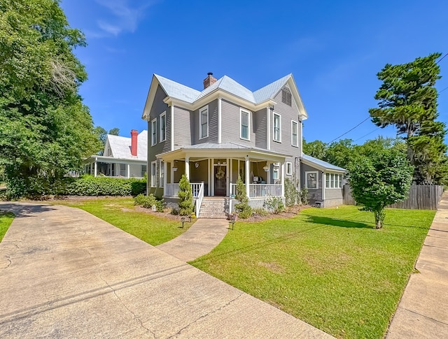 313 E Evans St, Bainbridge, GA 39817 - victorian home with a porch and a chimney