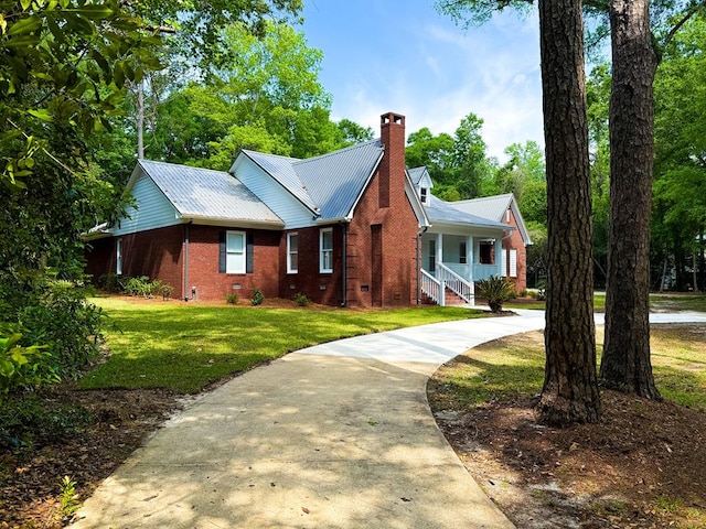 1870 SE Oakdale Rd, Cairo, GA 39828 - view of front of property featuring a chimney, brick siding, concrete driveway, and a front yard