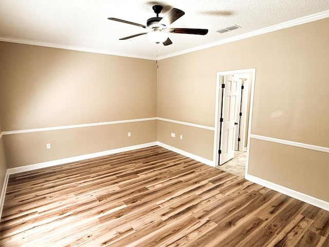 1870 SE Oakdale Rd, Cairo, GA 39828 - unfurnished room featuring wood finished floors, visible vents, ornamental molding, baseboards, and ceiling fan