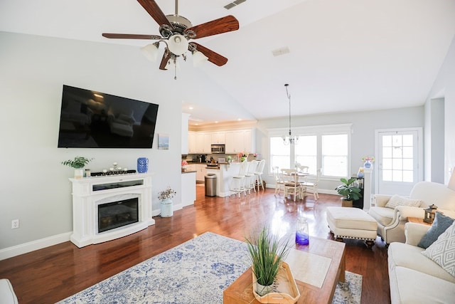 351 Virginia Cir, Cairo, GA 39828 - living room featuring ceiling fan, wood finished floors, lofted ceiling, baseboards, and a glass covered fireplace