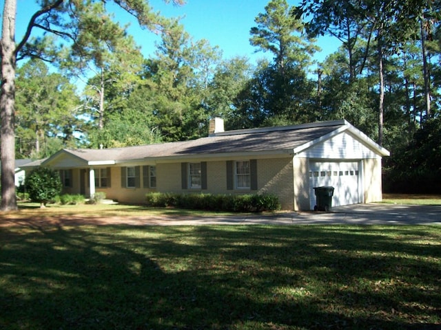 ranch-style house with a front yard and a garage